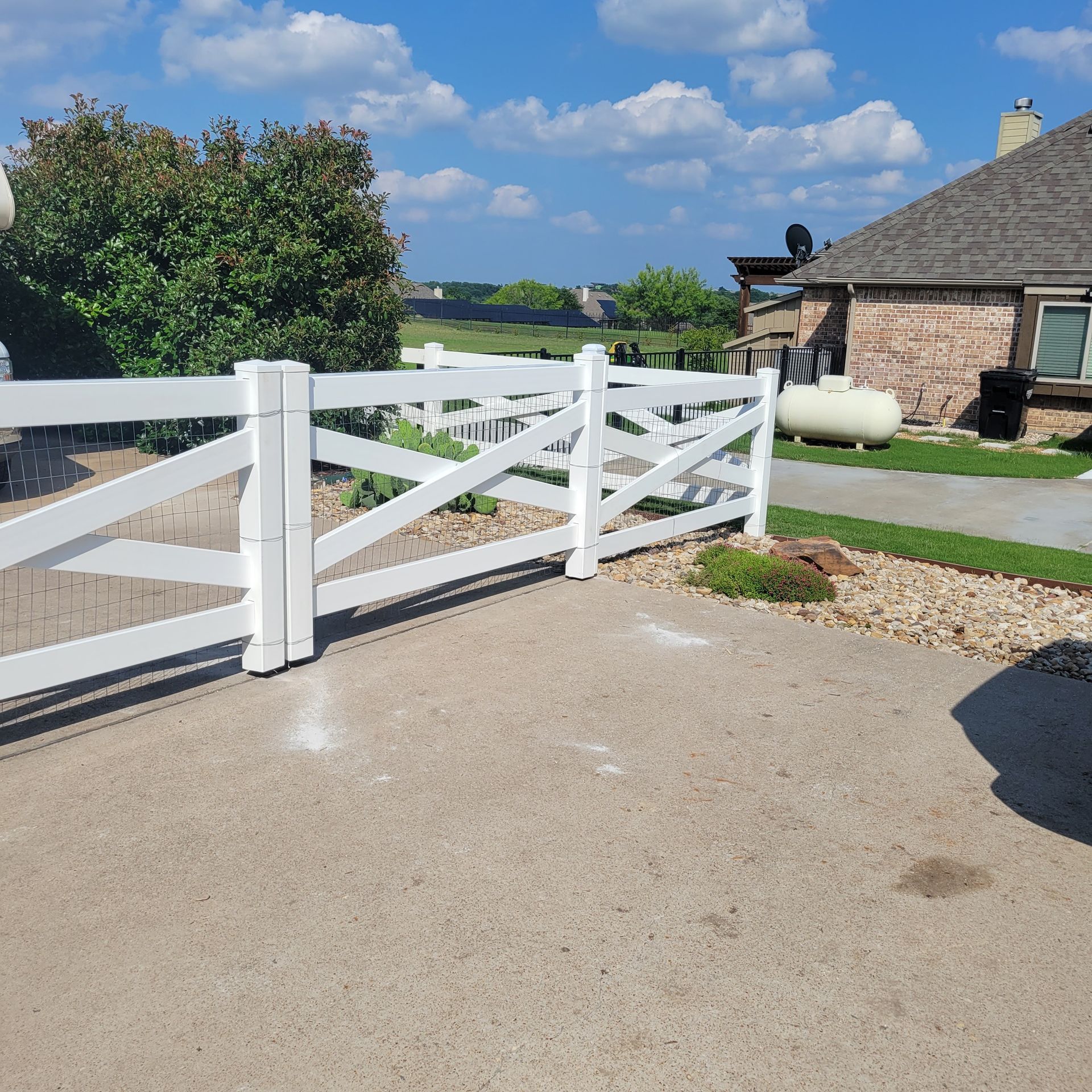 White vinyl fencing is a low maintenance ranch fencing