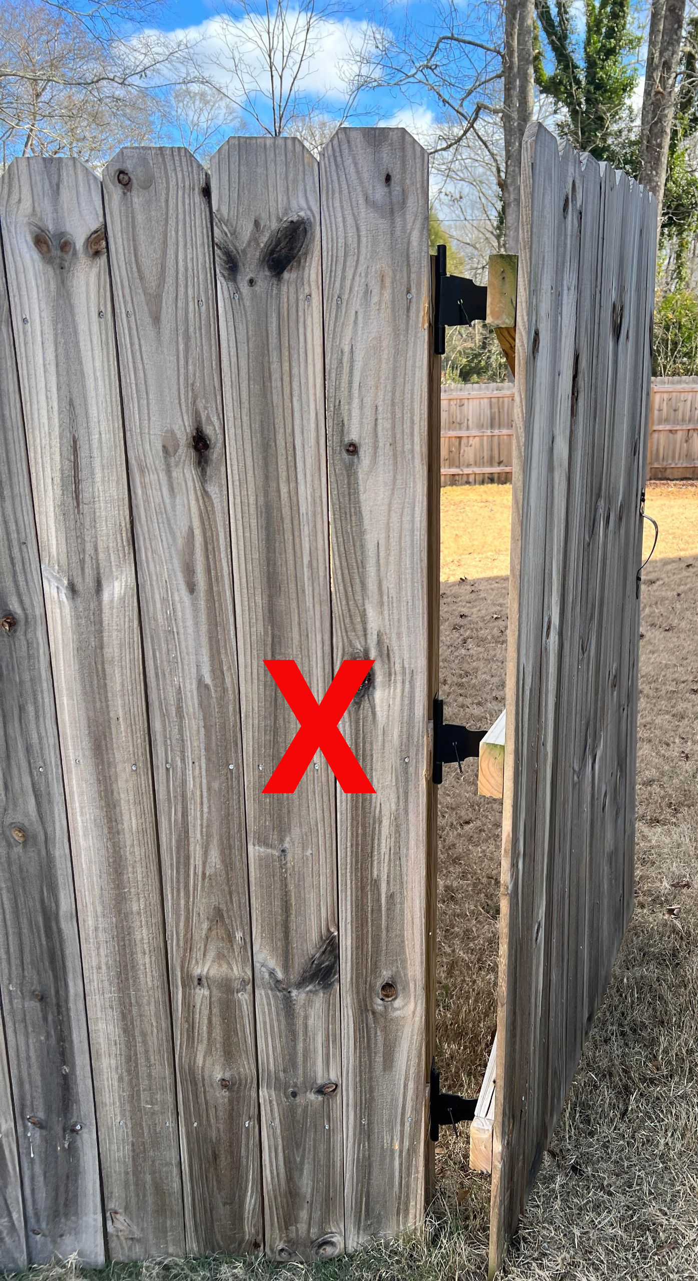 damaged wood gate