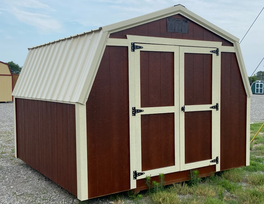 Brown and cream shed with a metal roof.