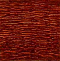 Close-up of reddish-brown wood grain with wavy, horizontal lines.