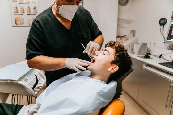 Dentist working on man's teeth — Geneva, NE — Geneva Family Dentistry