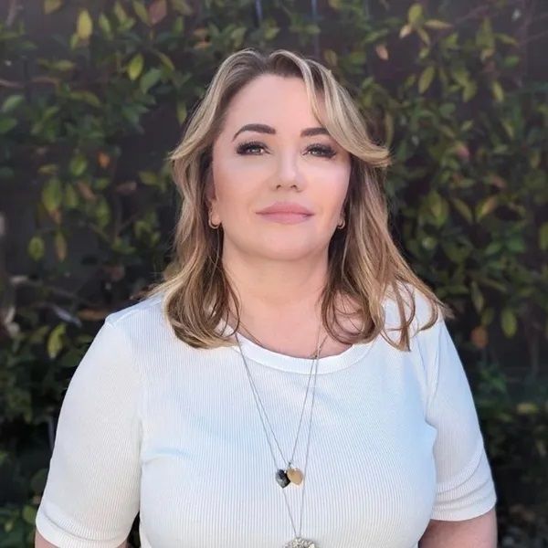 Pamela Brown Wearing White Top With Blonde Hair — Figures Right in Jerrabomberra, NSW