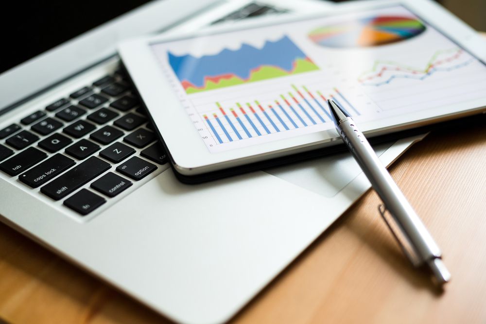 Tablet Displaying Charts For Bookkeeping Service Work