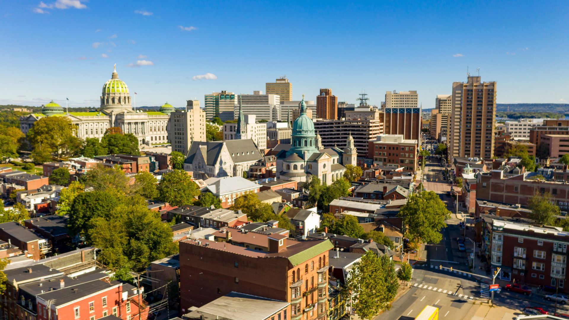 An aerial view of a city with a lot of buildings and trees.