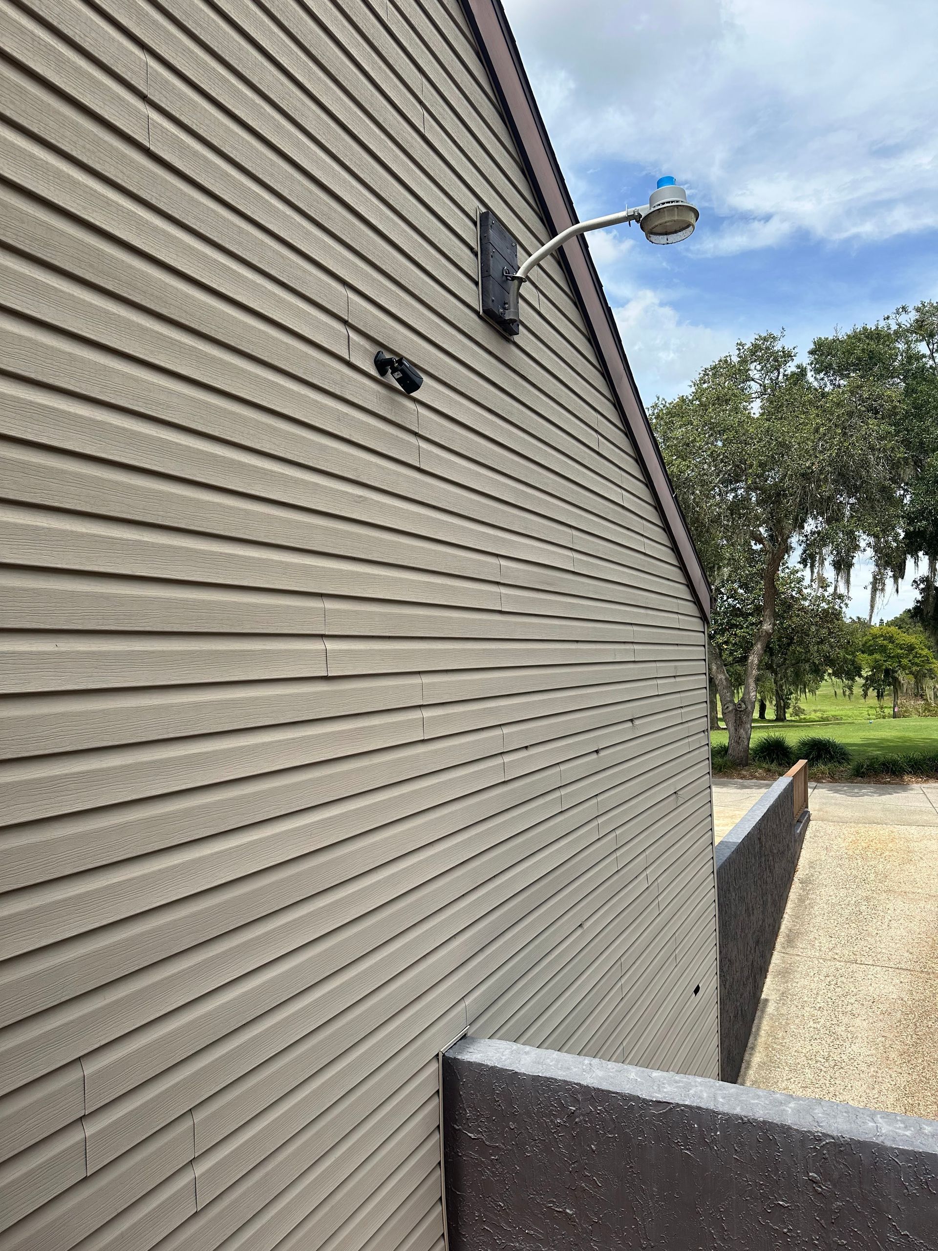 A building with a light on the side of it.