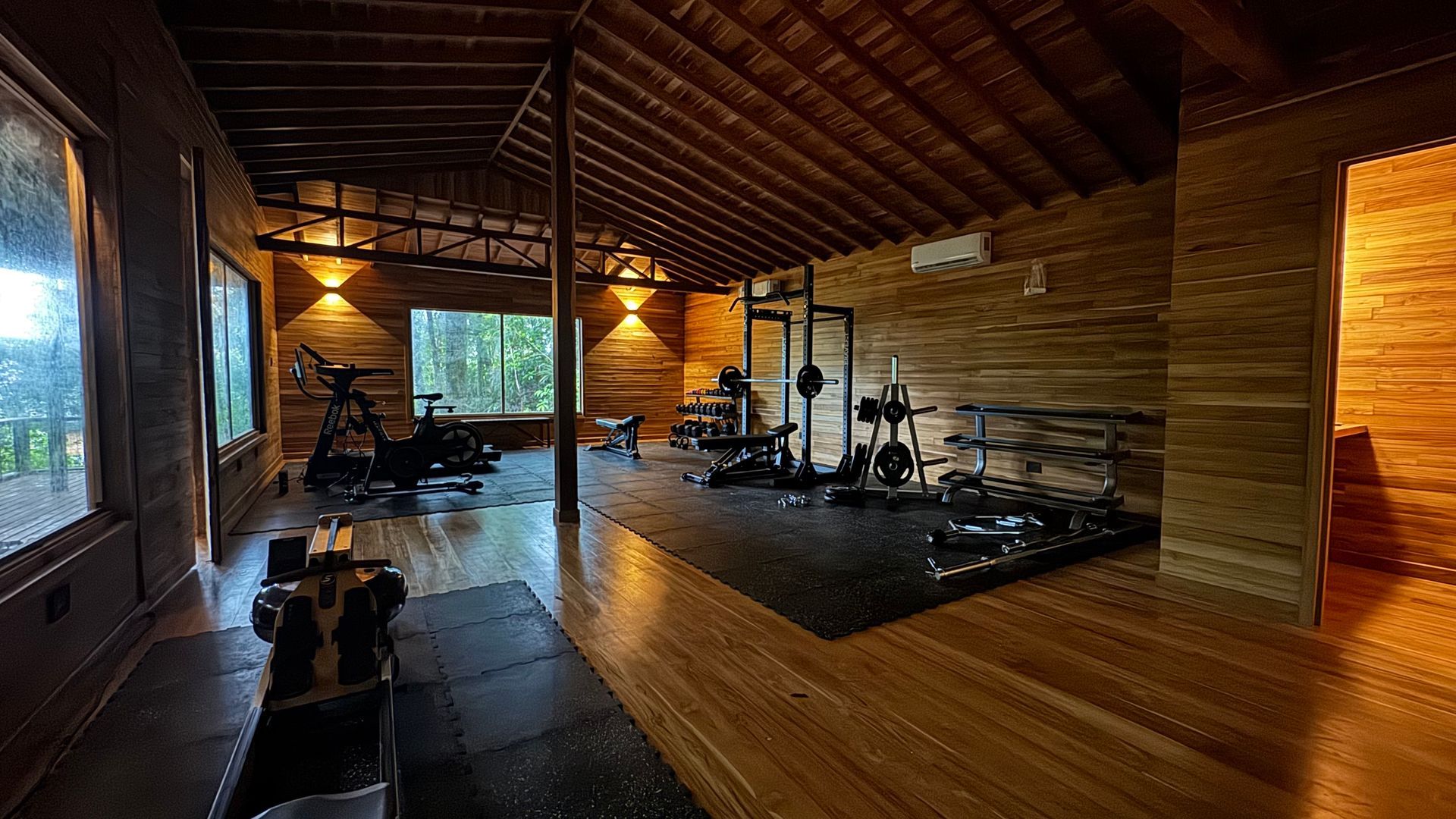 A wooden porch with a chair and a view of the ocean.
