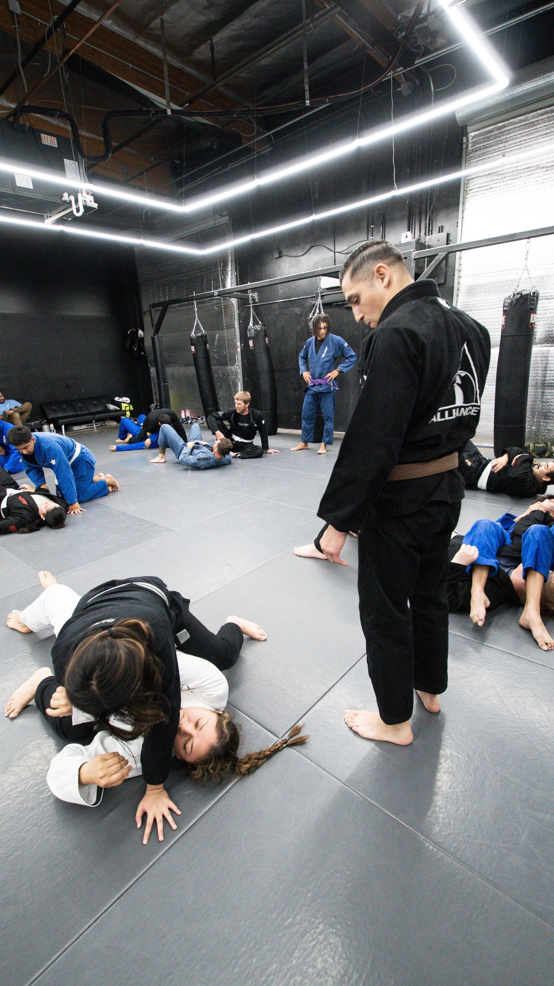 Adults drilling Brazilian Jiu Jitsu at Cobrinha Southwest in Las Vegas, NV, building fitness.