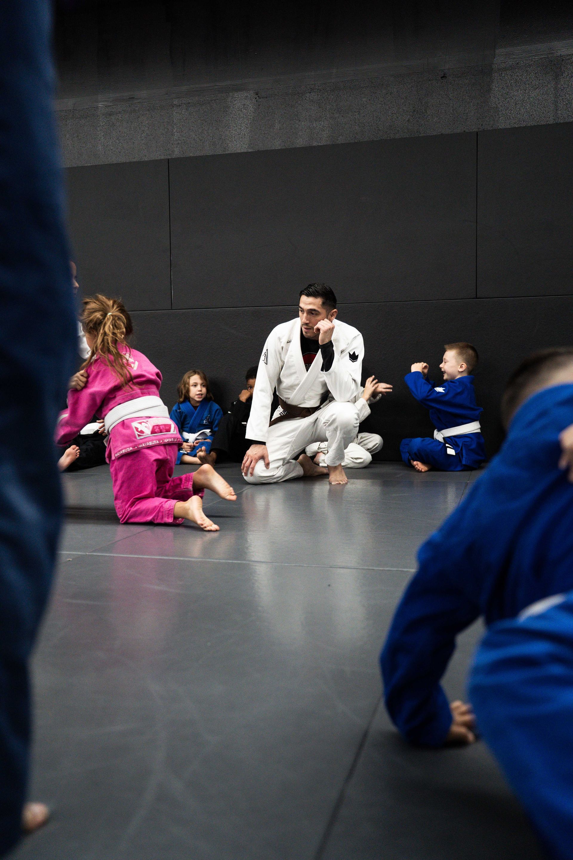 Students drilling Brazilian Jiu Jitsu techniques at Cobrinha Southwest in Las Vegas, NV.