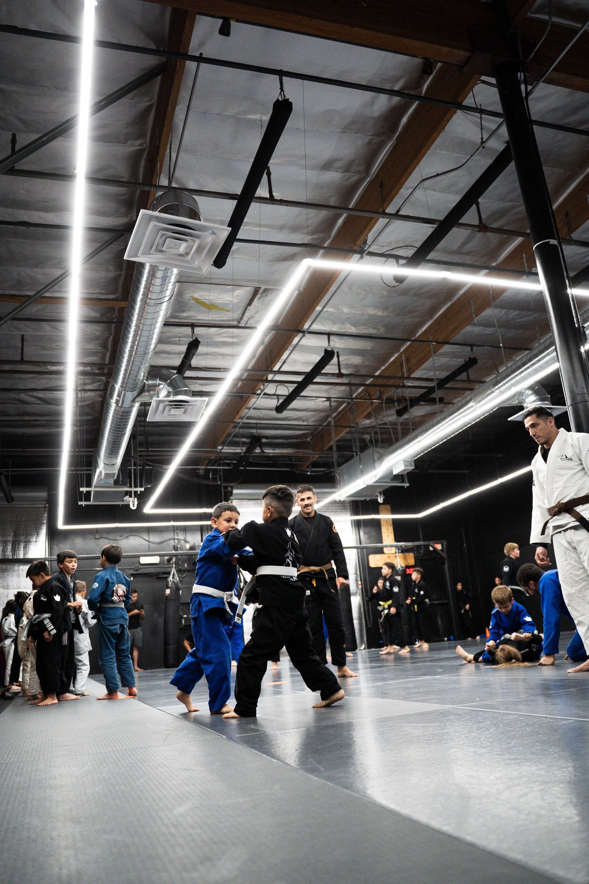 Students practicing Brazilian Jiu Jitsu drills at Cobrinha Southwest in Las Vegas, NV.