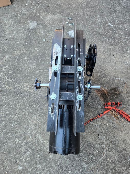 A piece of metal is sitting on a concrete surface.