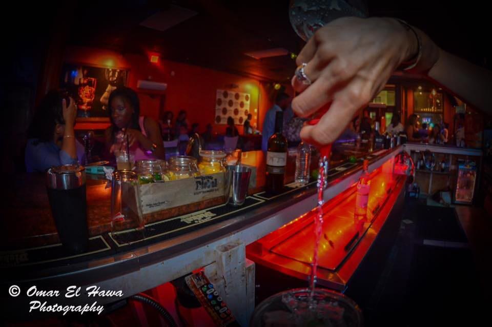 Bartender Pouring Beverage to Glass — Night Out in Worcester, MA