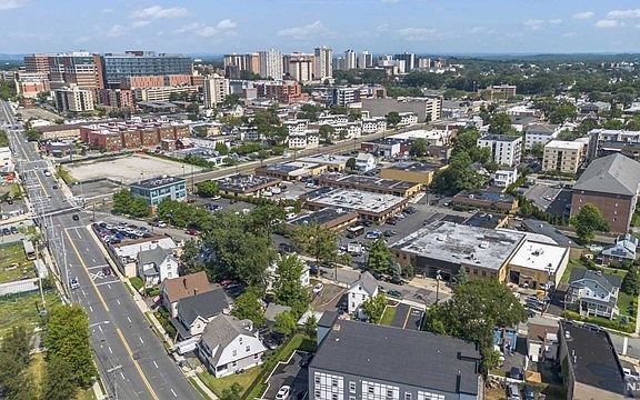 An aerial view of a city with a lot of buildings and trees.