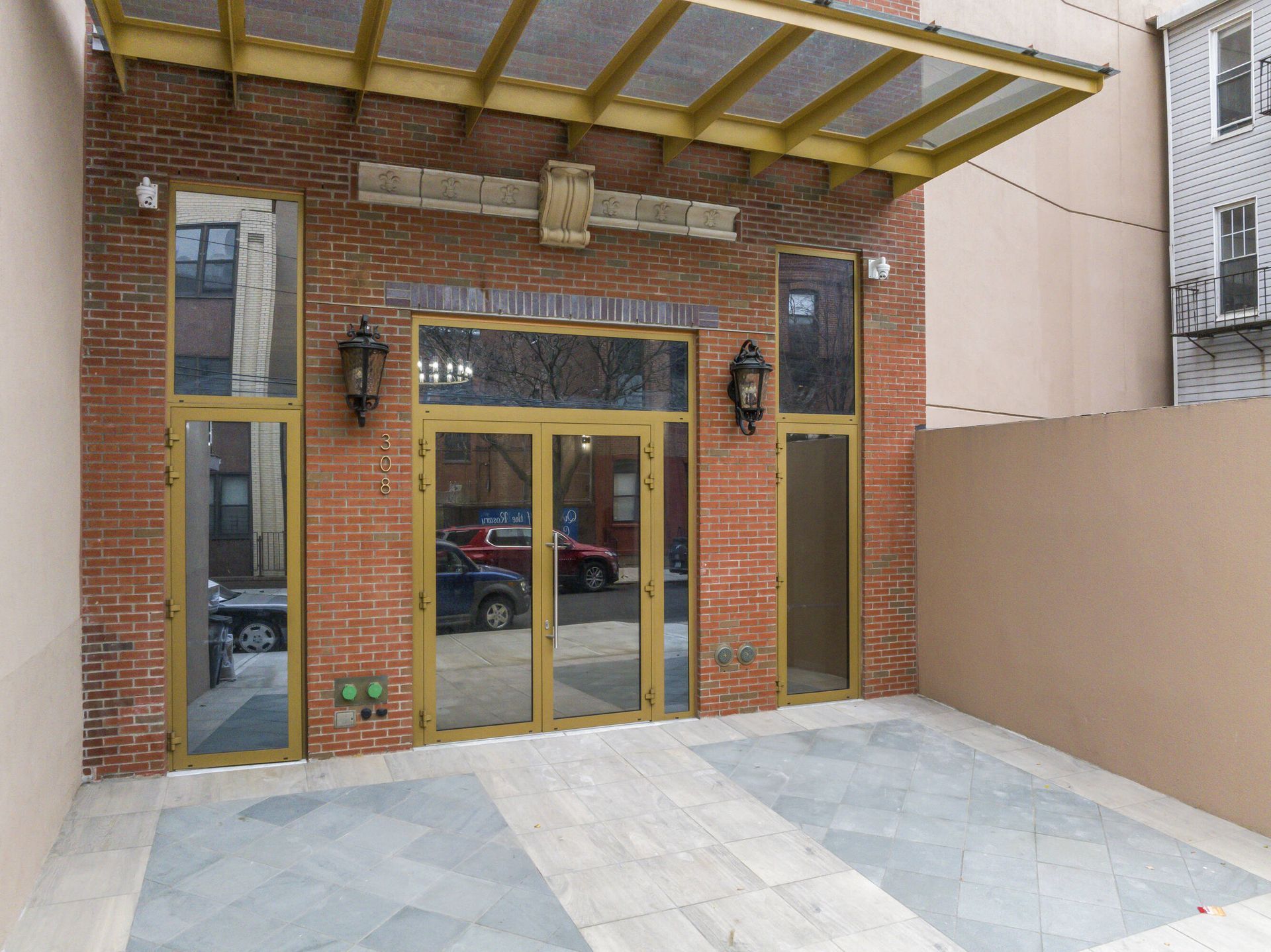 A brick building with a lot of windows and doors