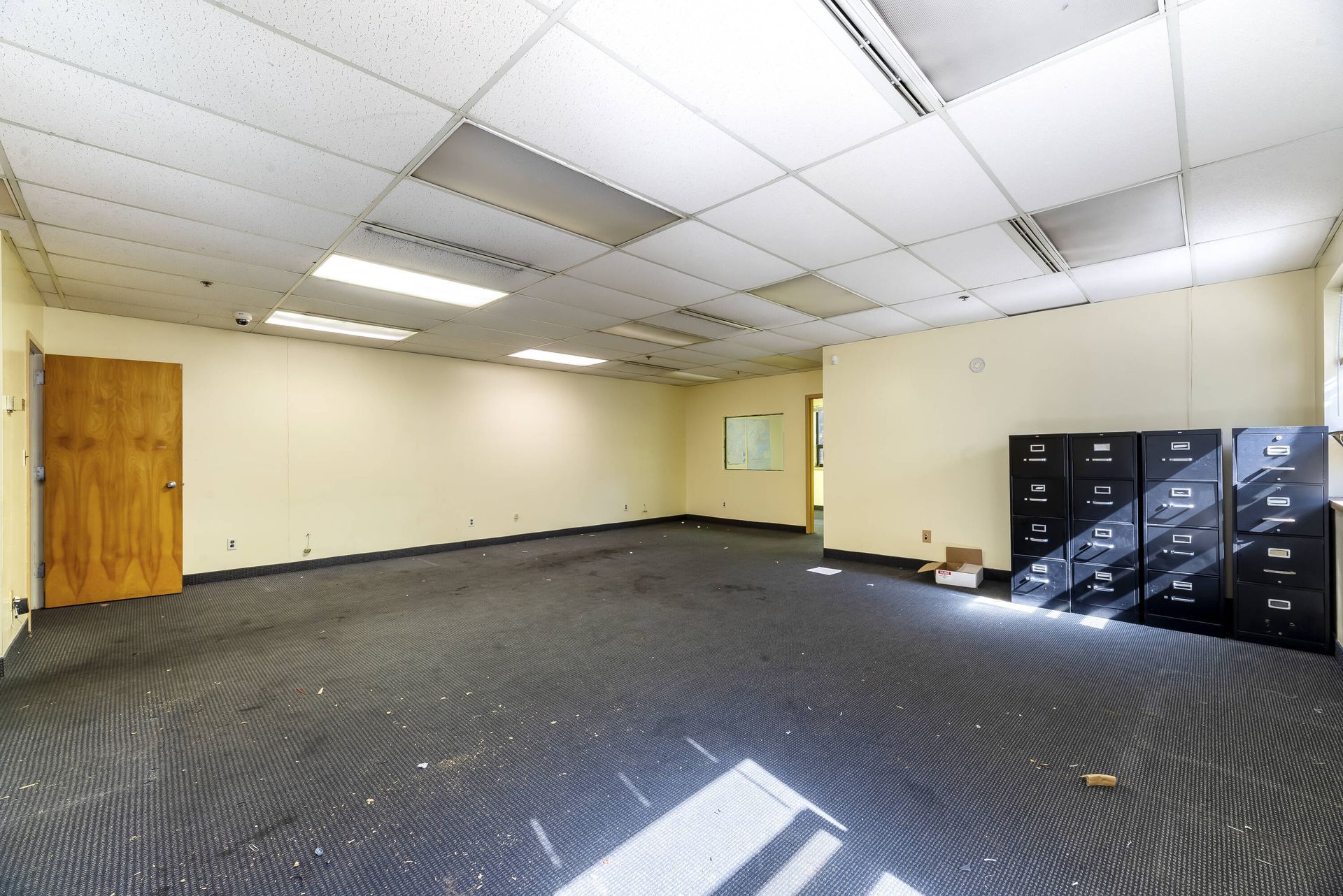 An empty room with a lot of lockers in it