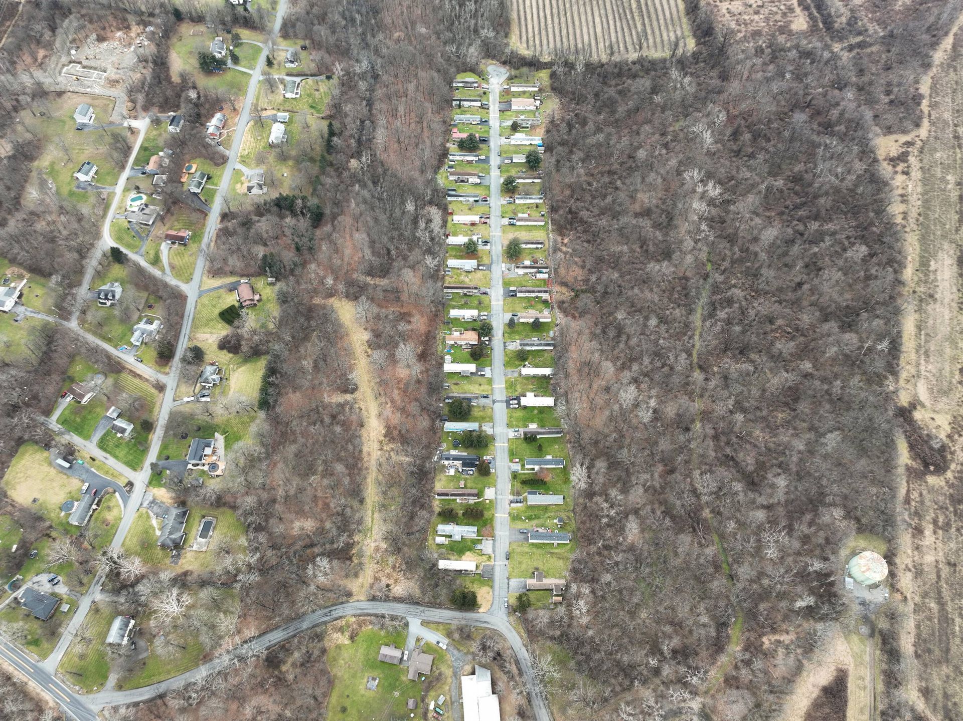 An aerial view of a residential area with lots of houses and trees.