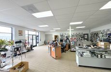 A large room filled with lots of furniture and displays in a store.