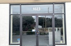 The front door of a building with the number 1023 on it.