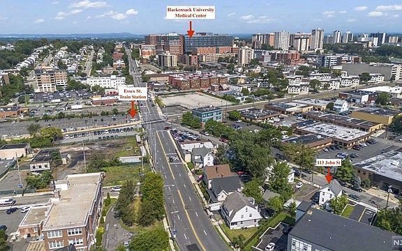 An aerial view of a city with a lot of buildings and trees.