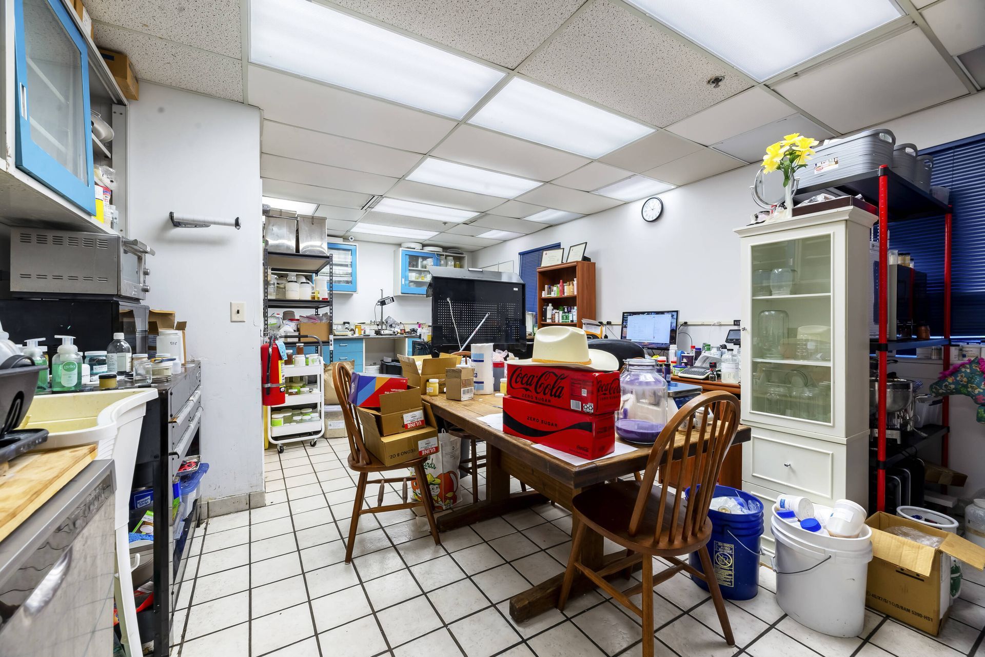 A room with a table and chairs in it