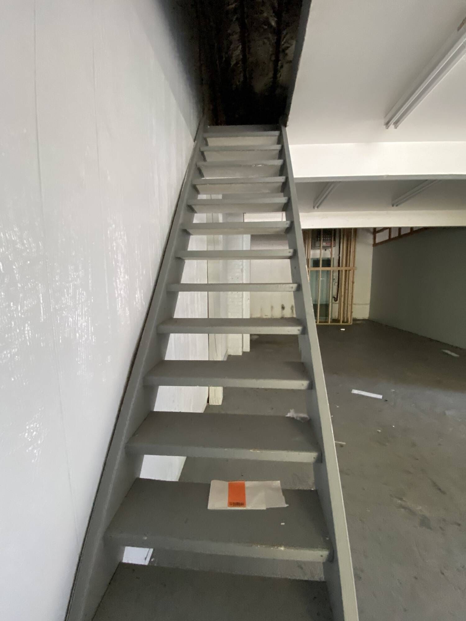A set of stairs leading up to the second floor of a building.