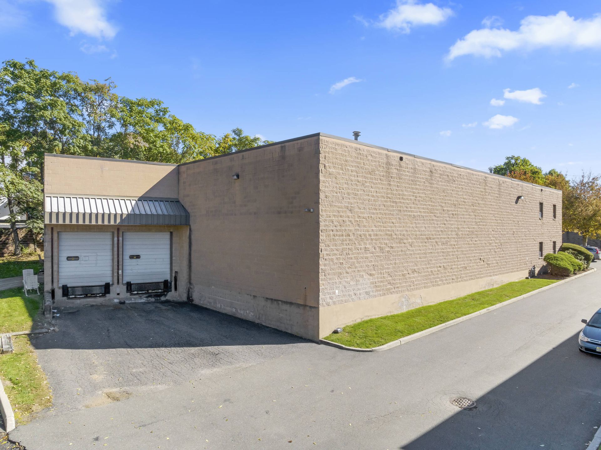 A large brick building with a loading dock on the side of it.