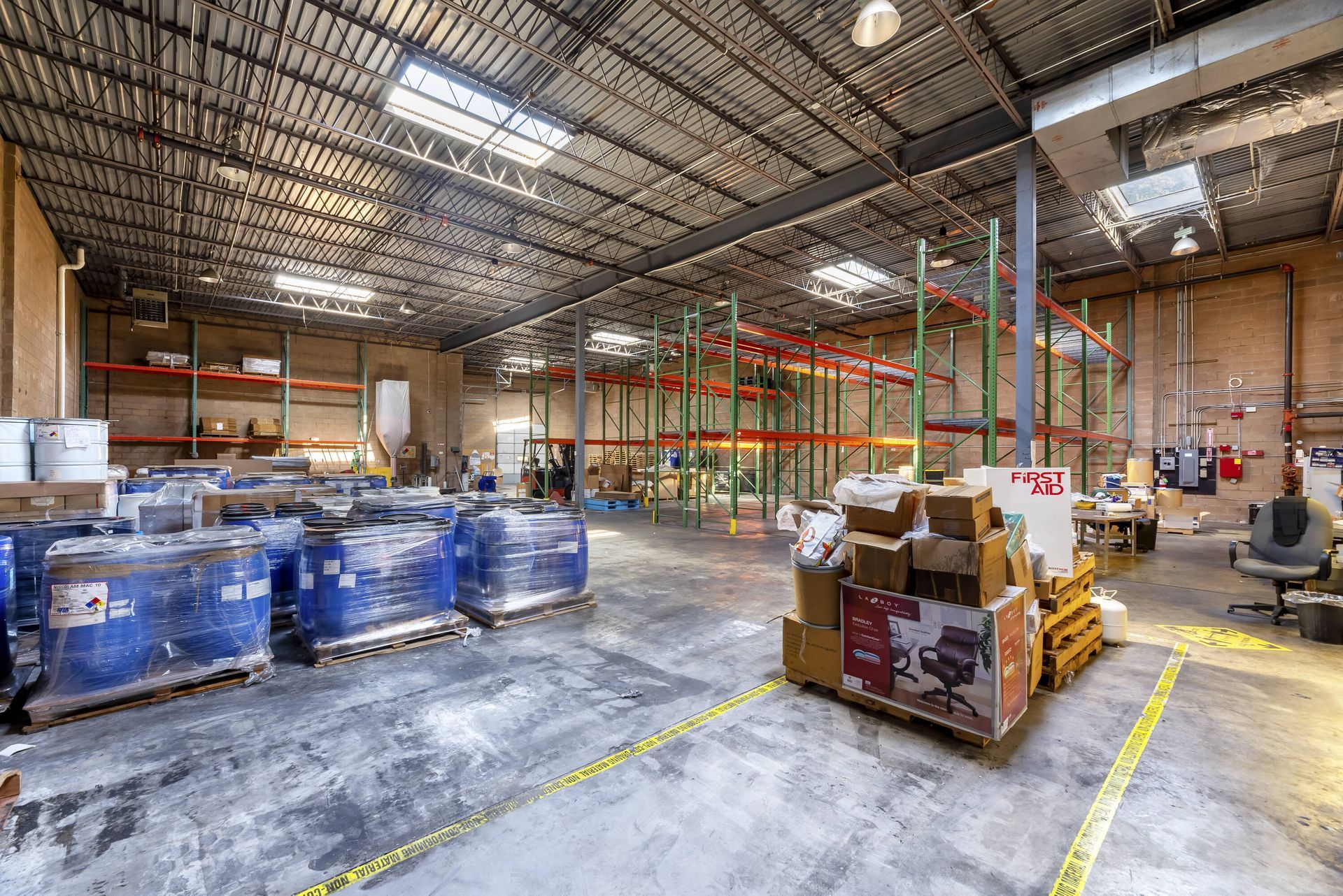 A large warehouse filled with lots of boxes and shelves.