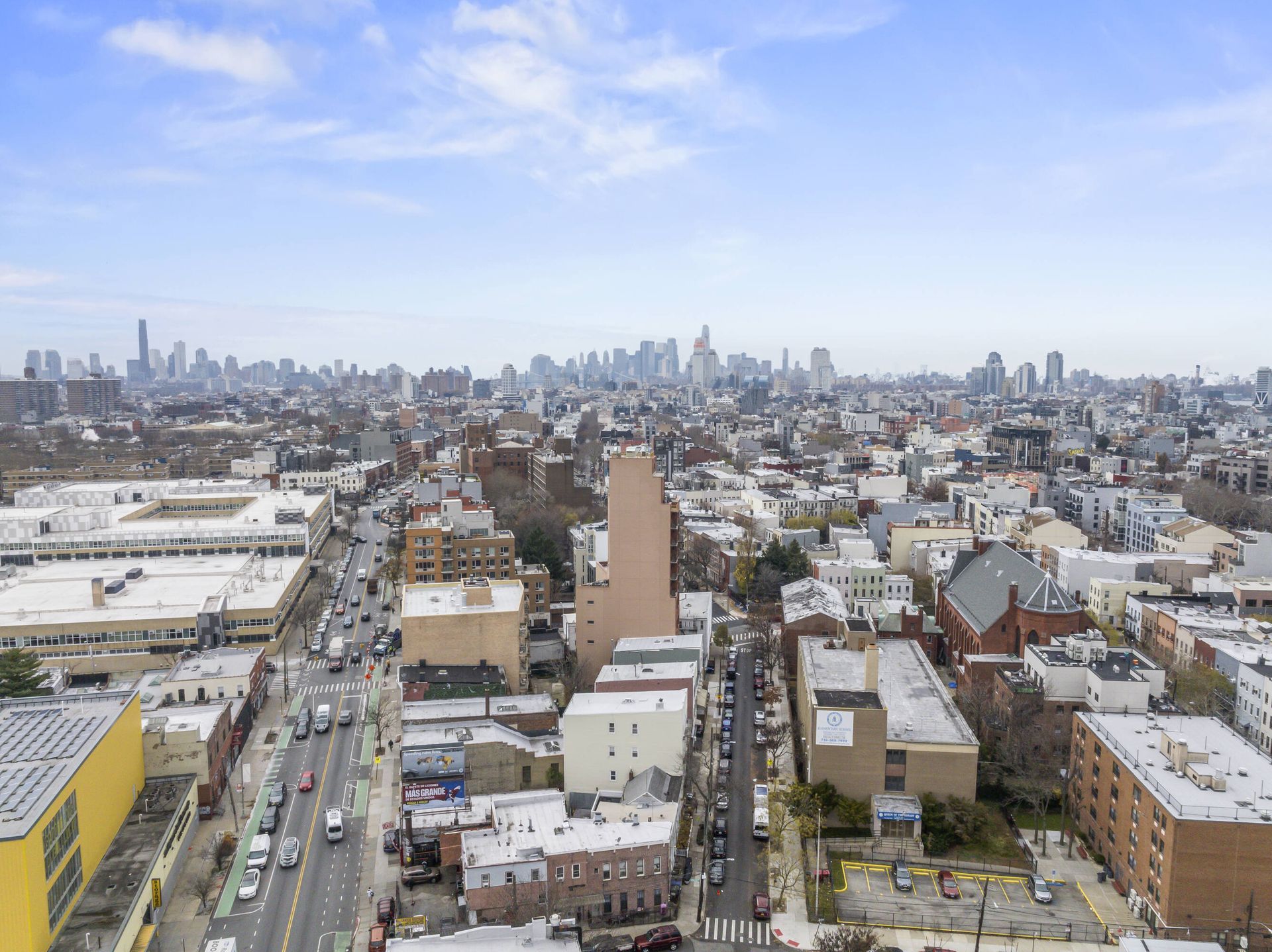 An aerial view of a city with a lot of buildings and roads
