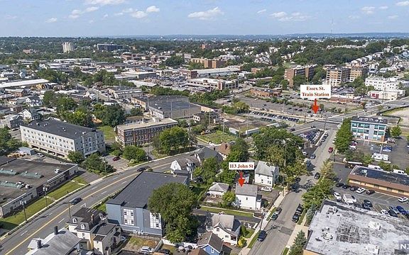 An aerial view of a city with a lot of buildings and trees.