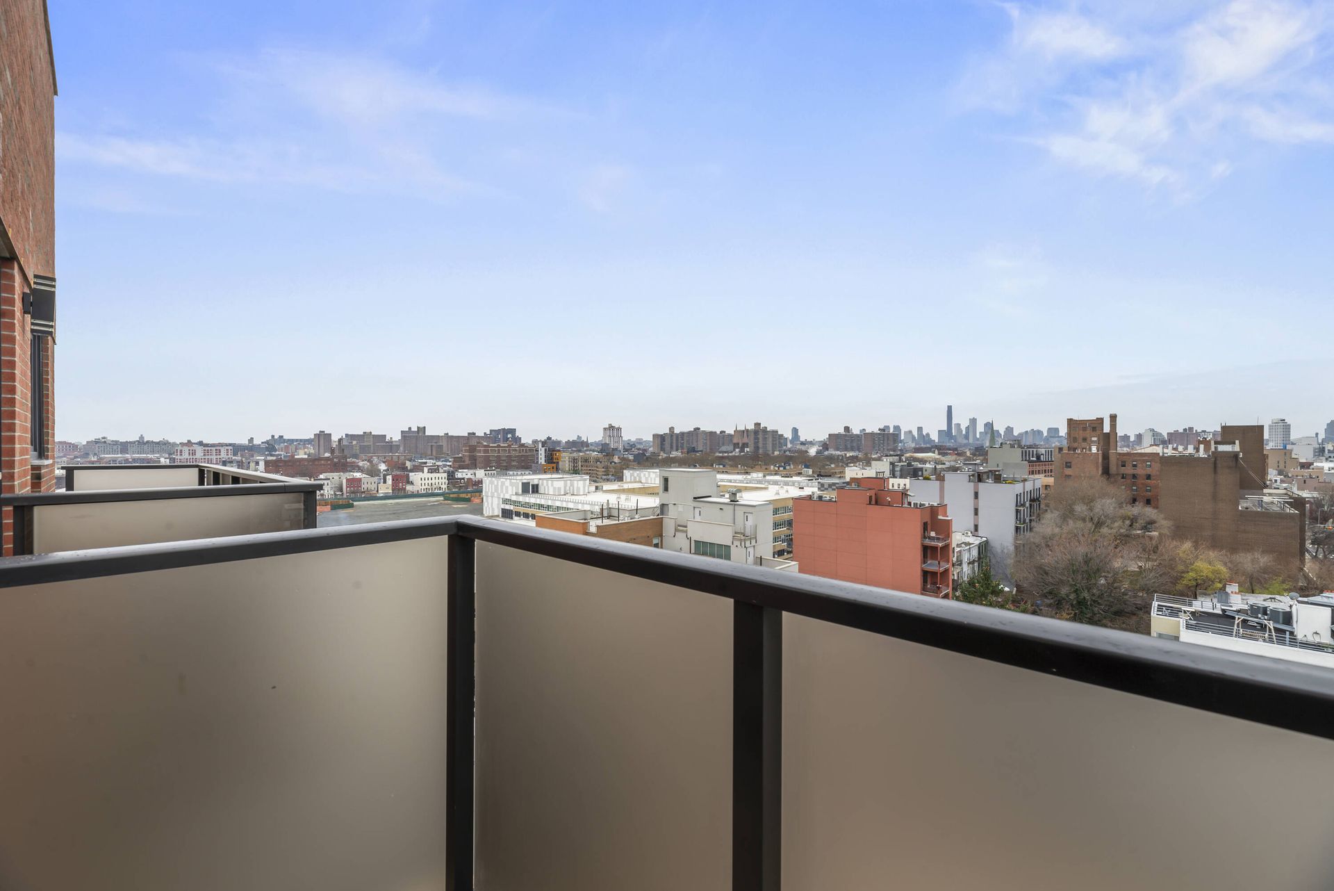 There is a balcony with a view of the city.
