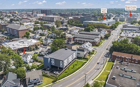 An aerial view of a city with a lot of buildings and trees