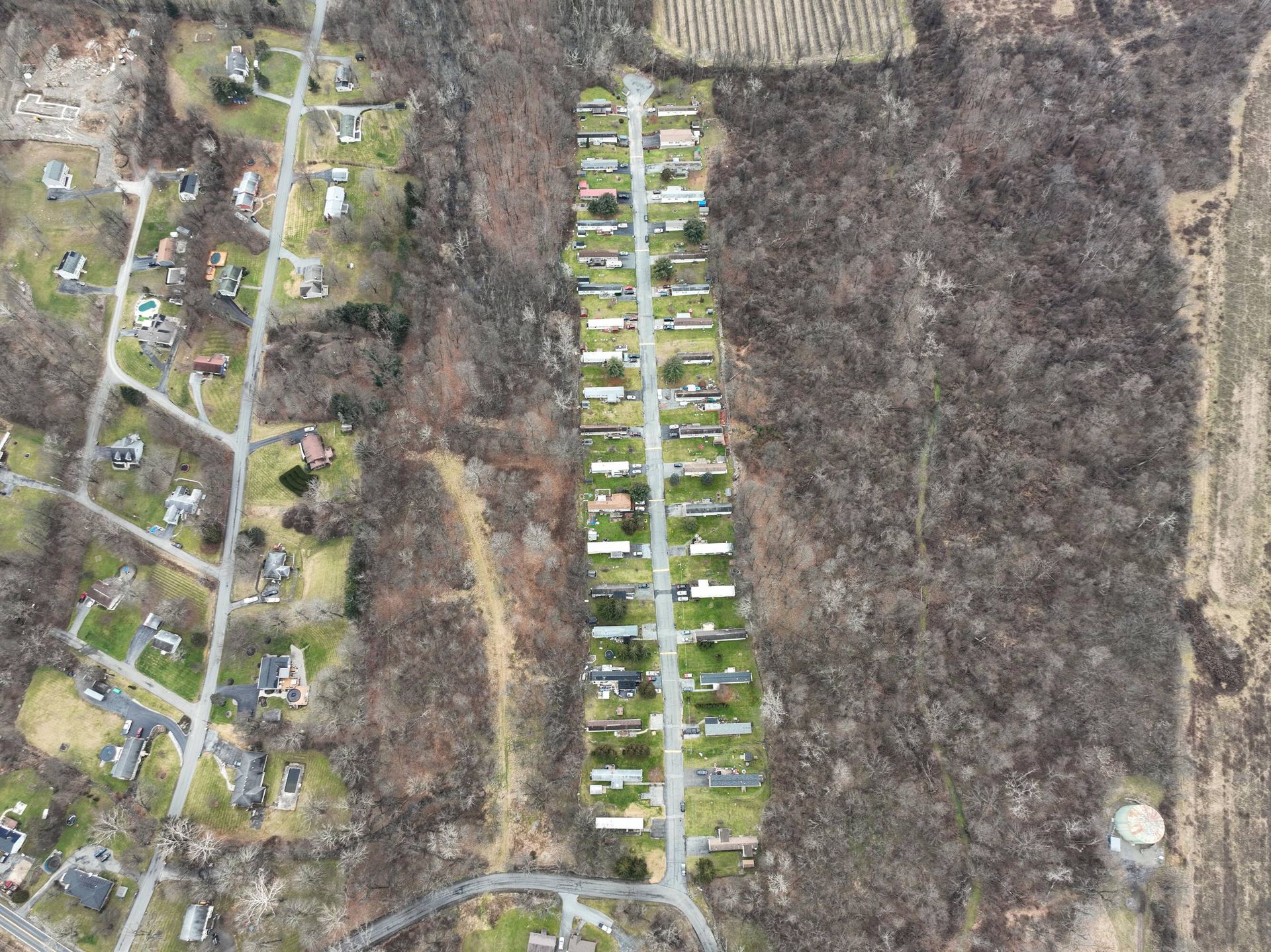 An aerial view of a residential area with lots of houses and trees.