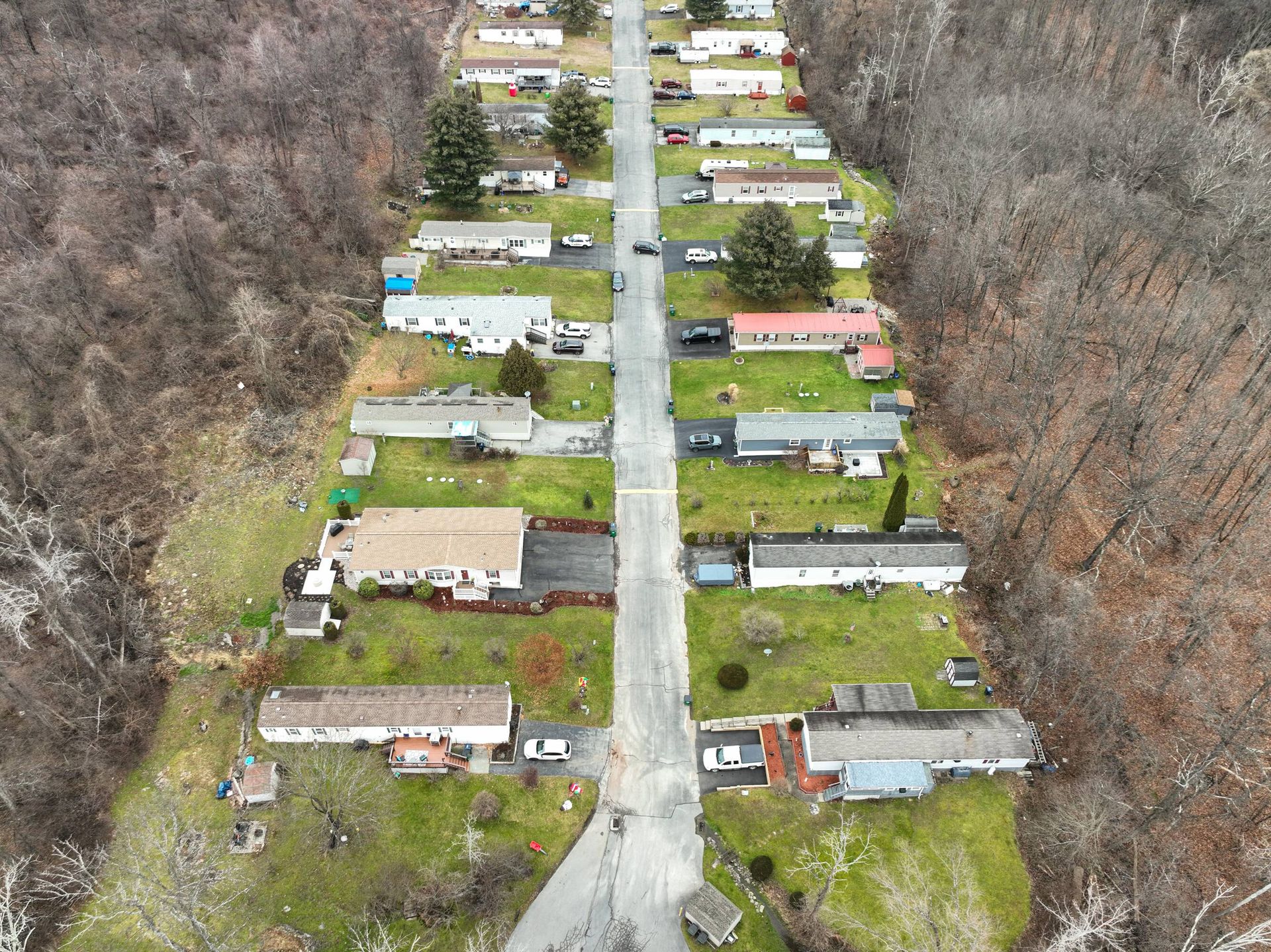 An aerial view of a residential area with lots of houses and trees