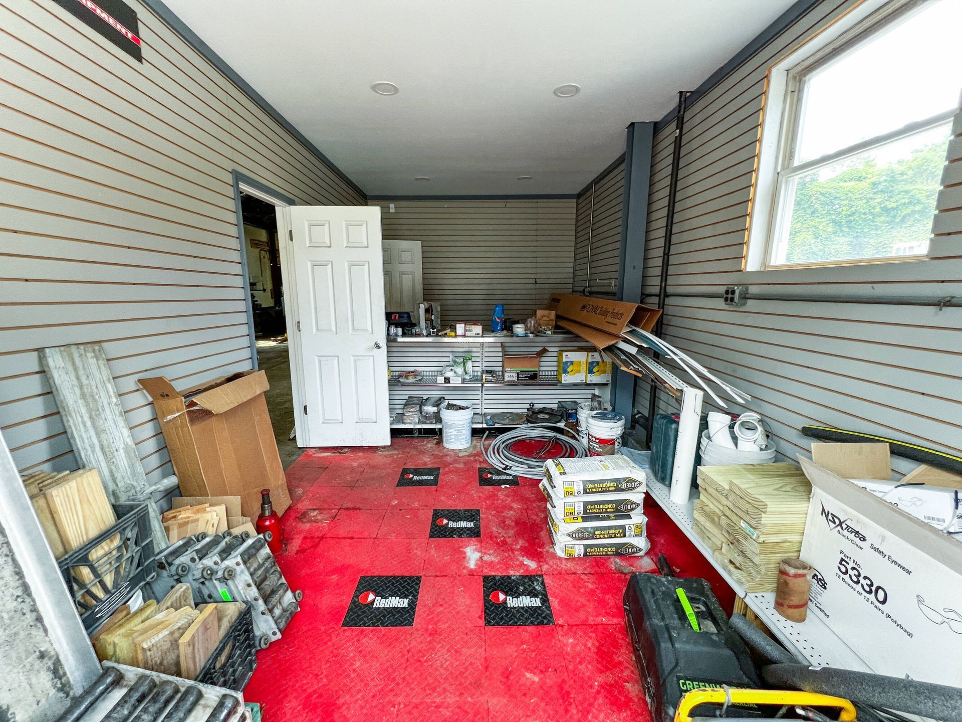 A garage filled with lots of tools and boxes.