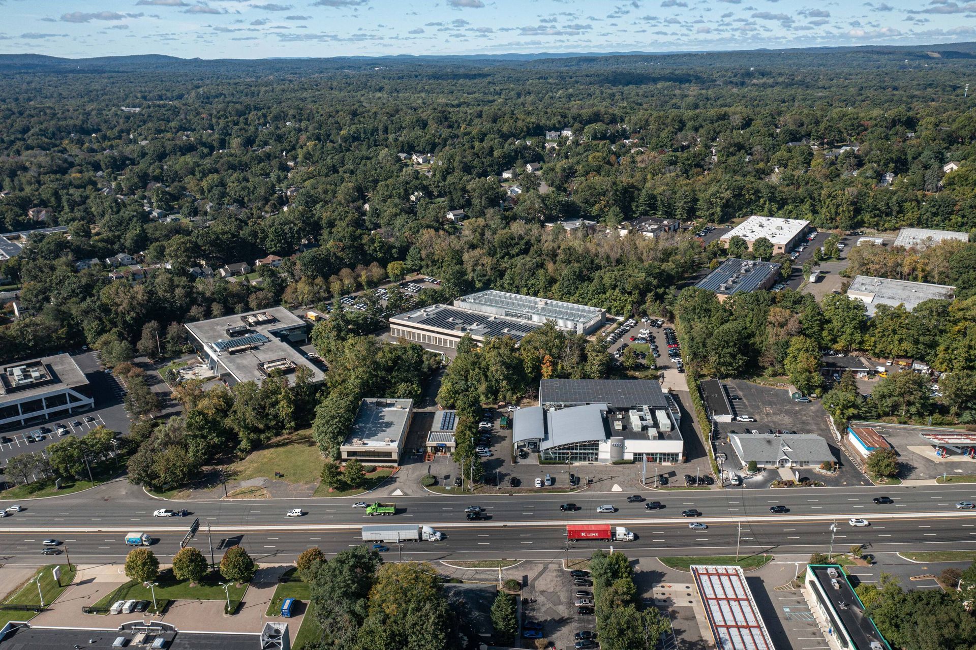 An aerial view of a city with lots of buildings and trees.