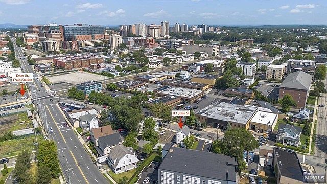 An aerial view of a city with a lot of buildings and trees.