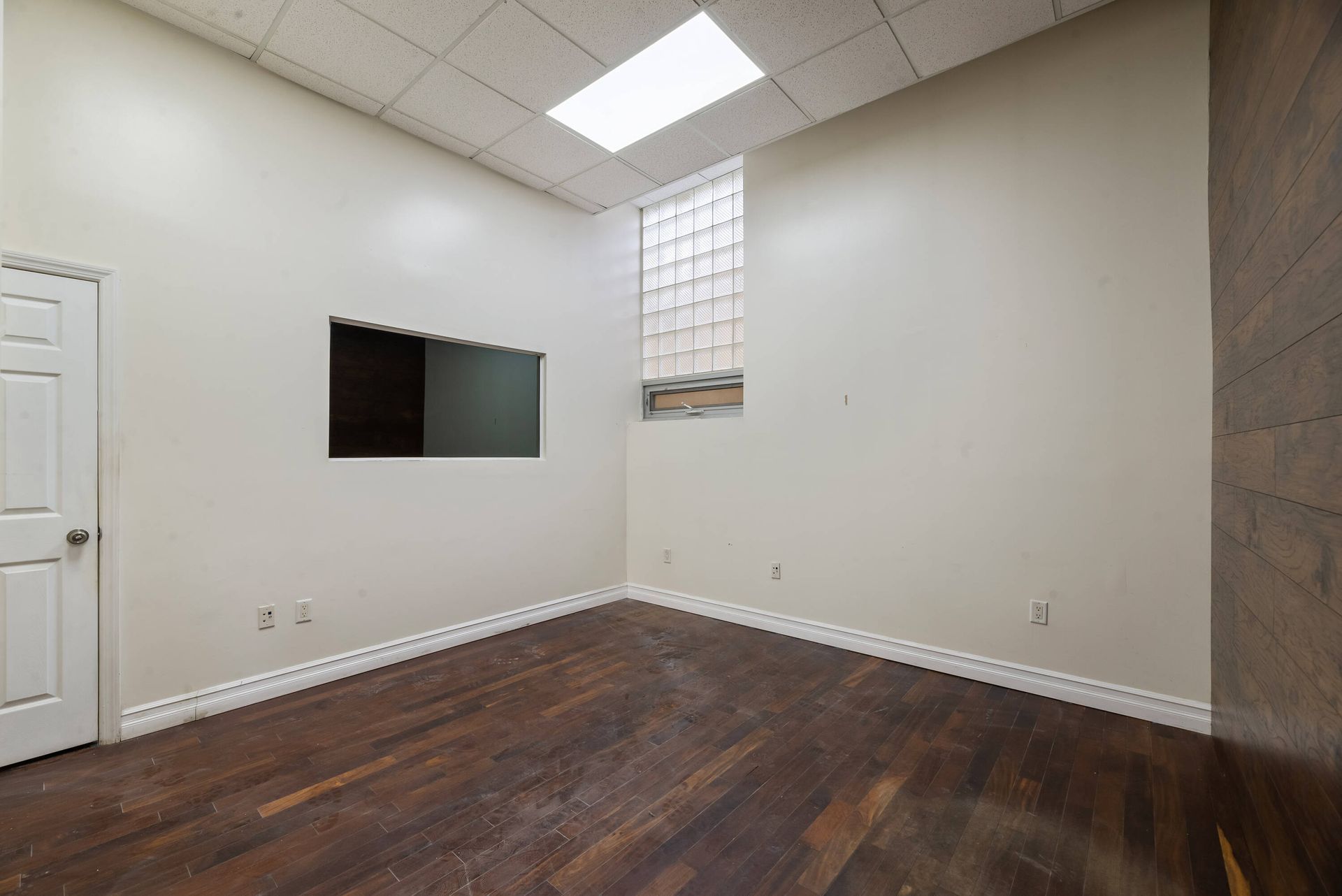 There is a window in the corner of the room.