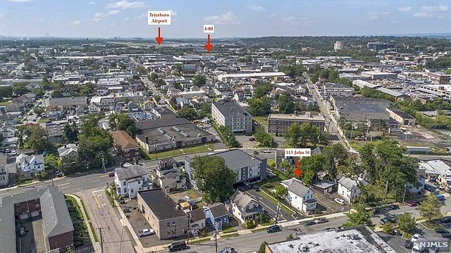 An aerial view of a city with a lot of buildings and trees.
