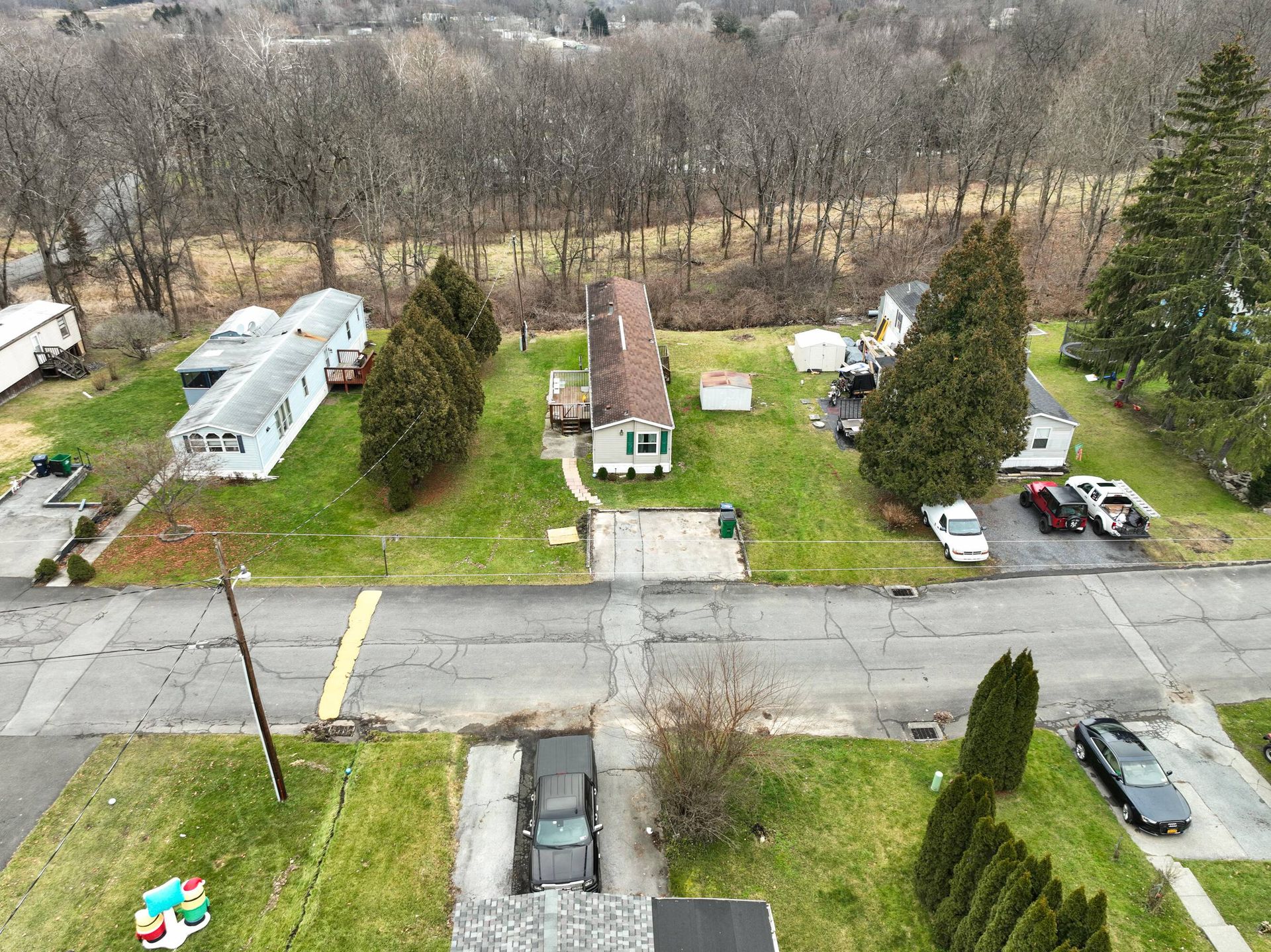 An aerial view of a residential area with a lot of houses and trees.