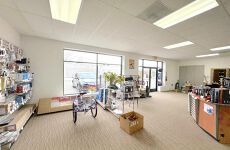 A large room with a lot of shelves and boxes in it.