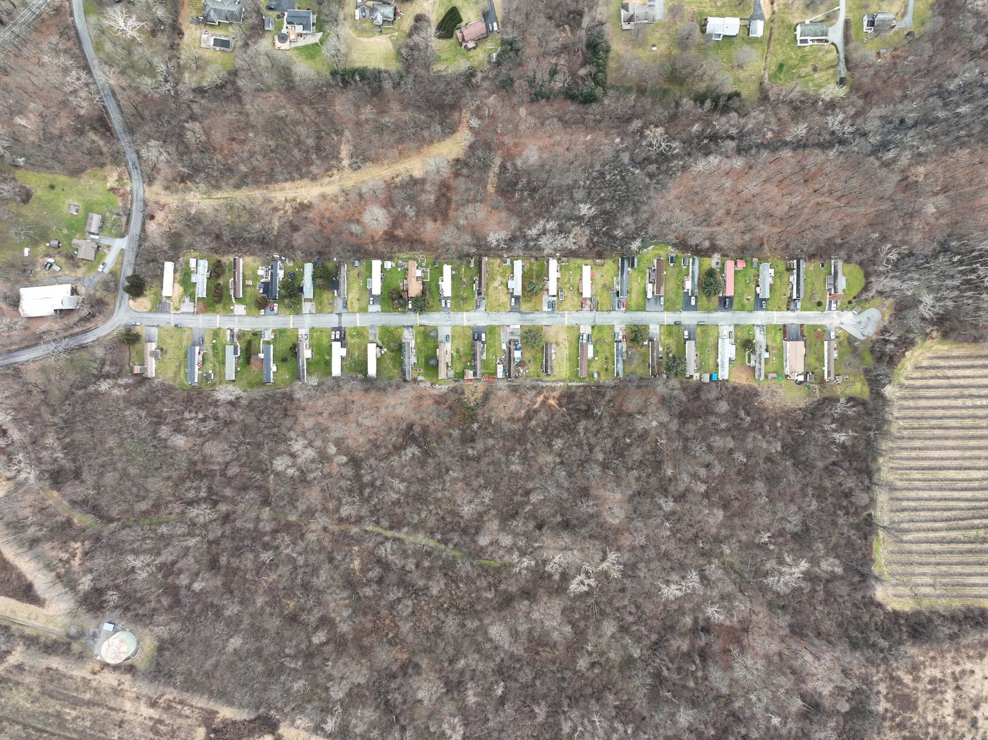 An aerial view of a row of houses in a residential area.