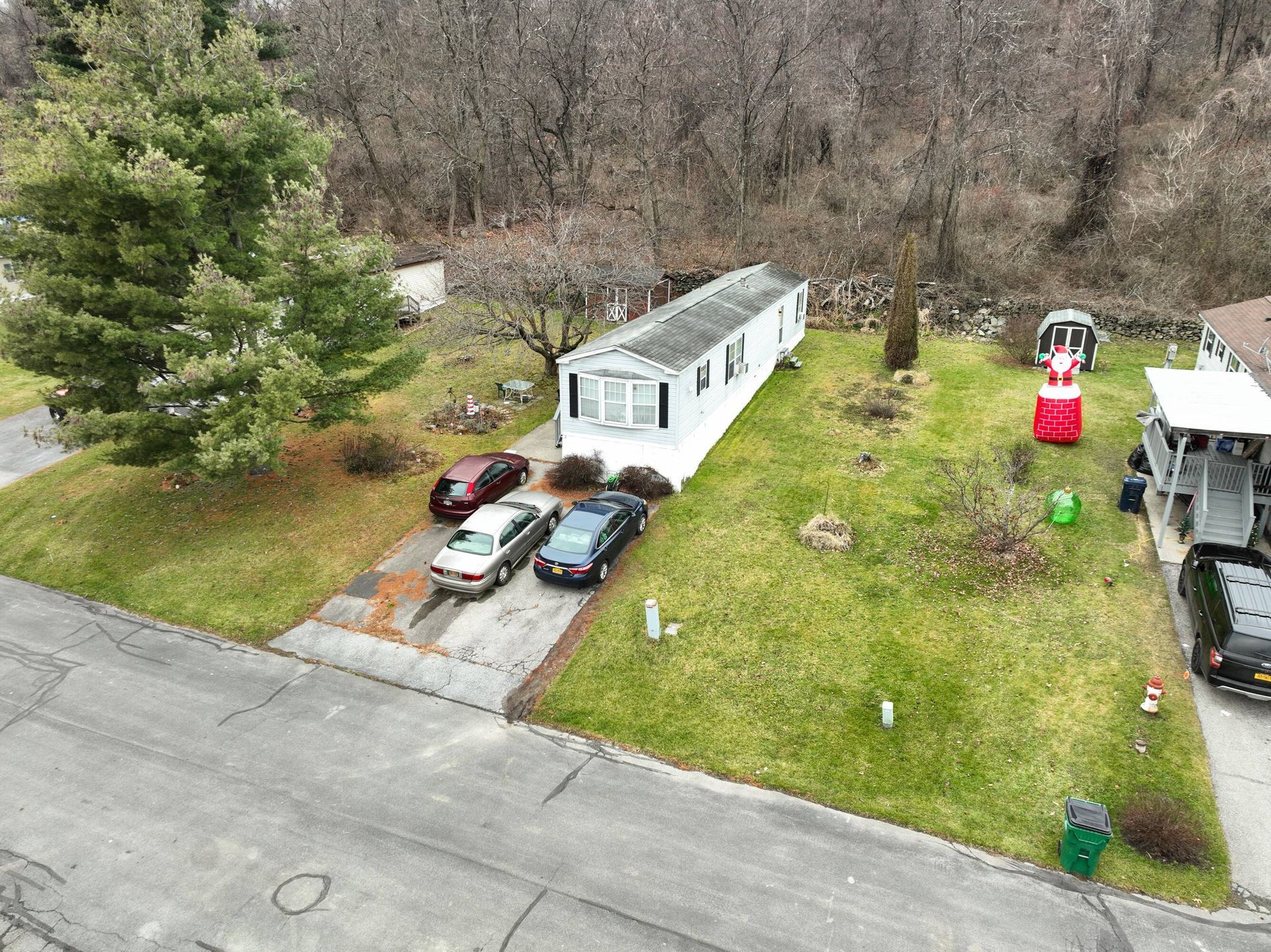 An aerial view of a mobile home in a residential neighborhood.
