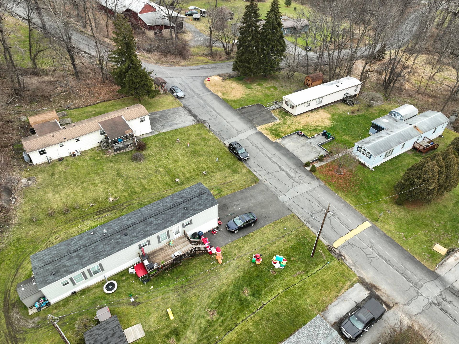 An aerial view of a mobile home park in a small town.