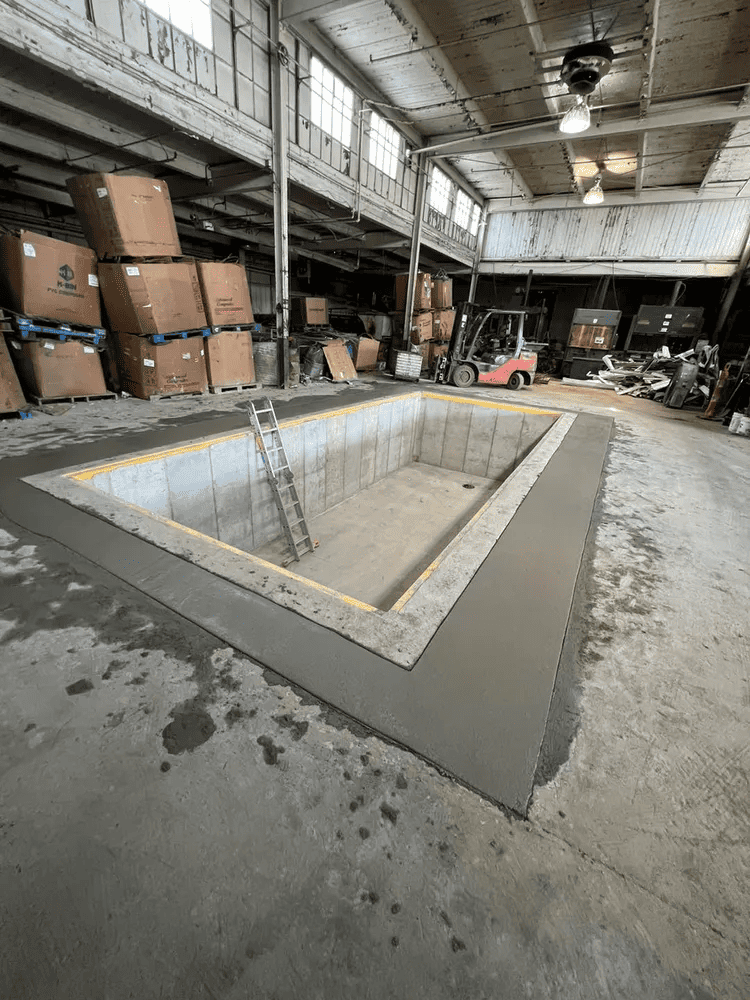 A large warehouse filled with boxes and a forklift.