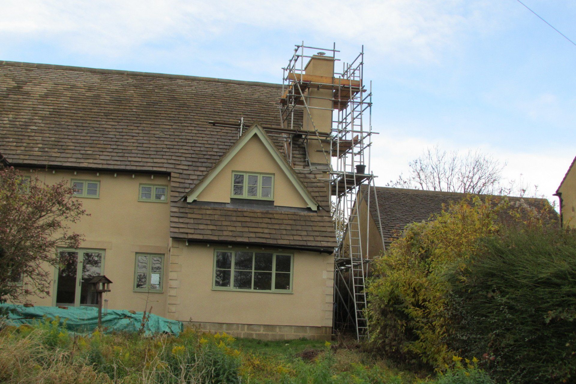 A house with scaffolding on the side of it