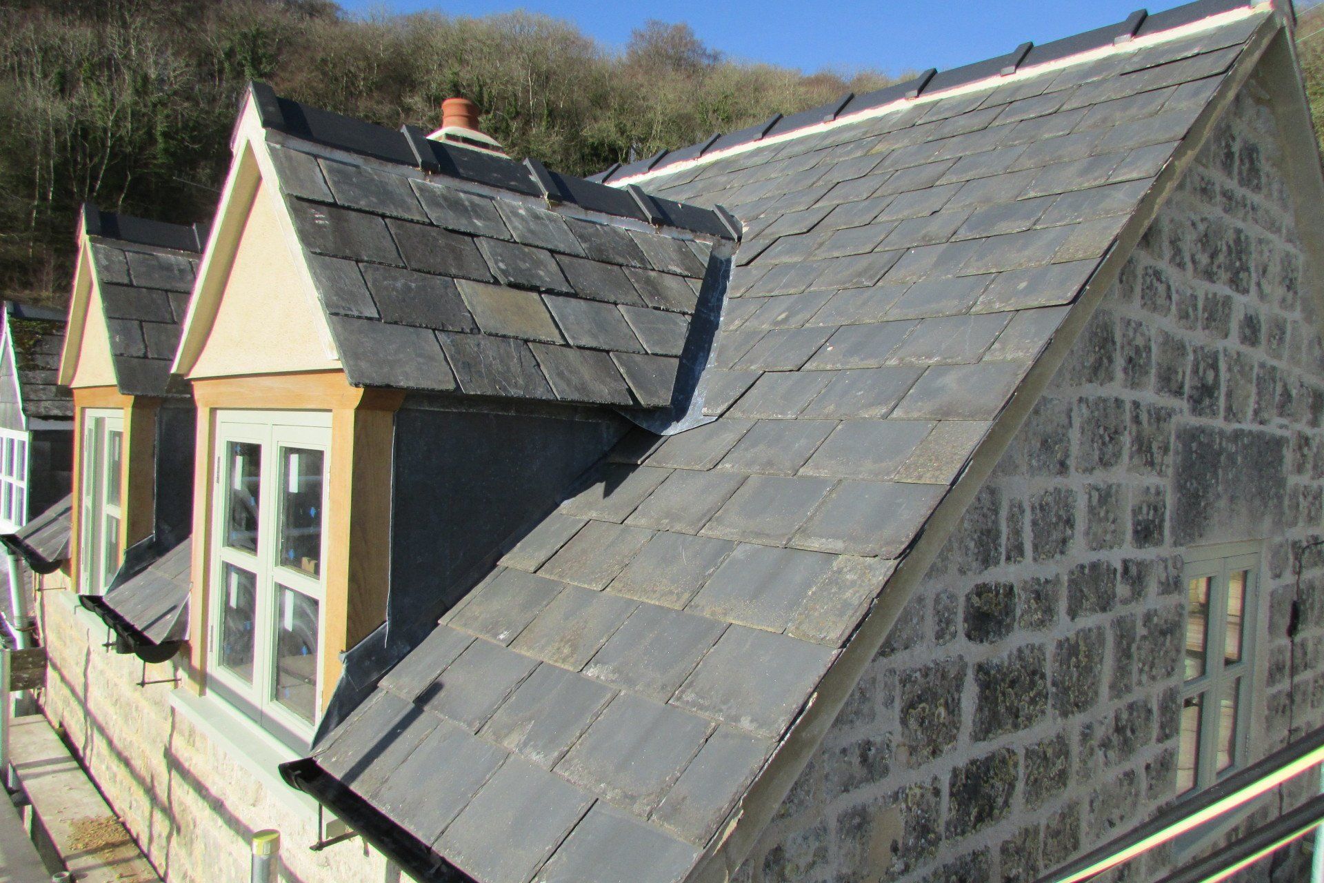 The roof of a building with a slate roof