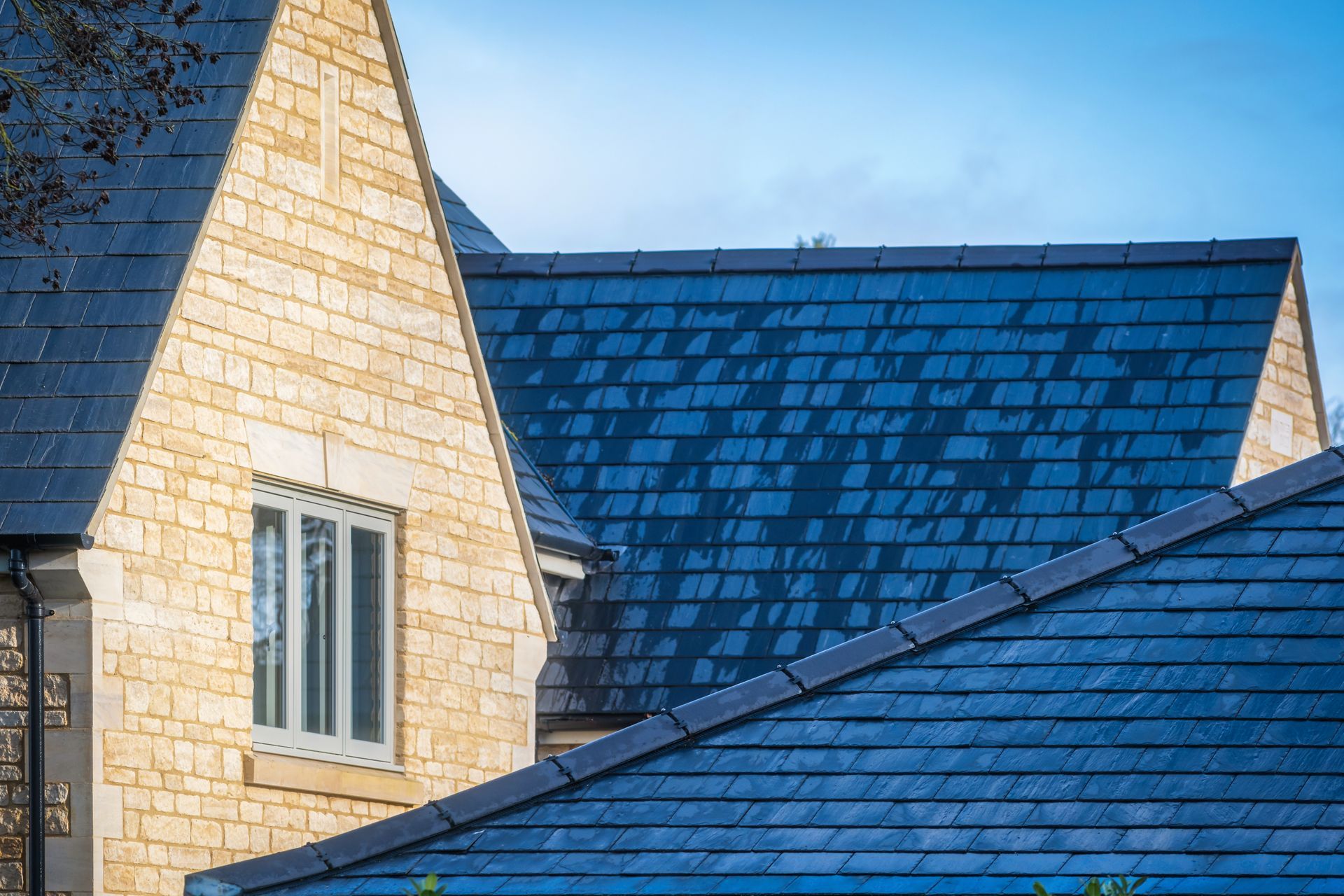 A kitchen with a wooden table and chairs and a large island.