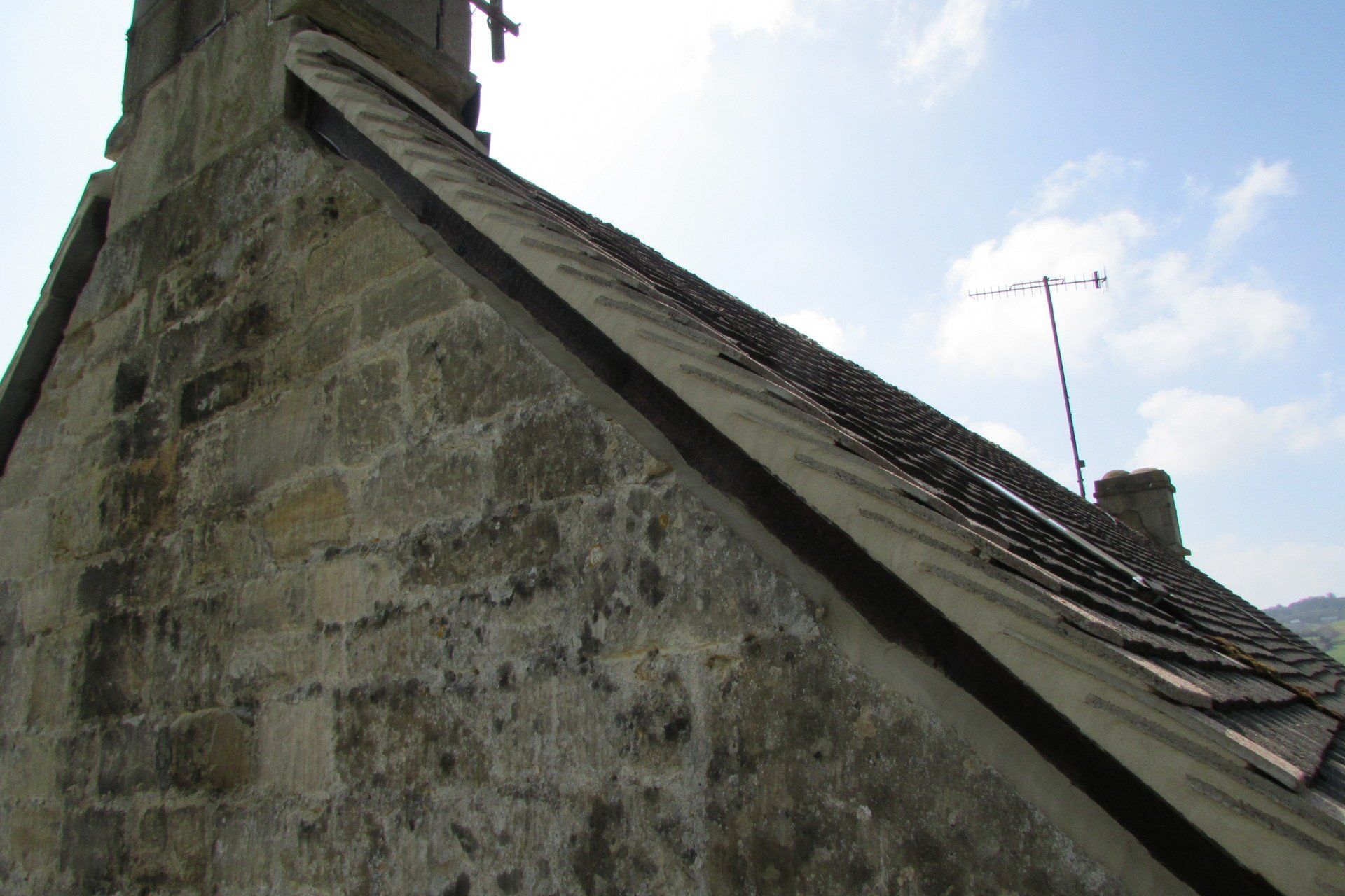 The roof of a building with a chimney on top of it