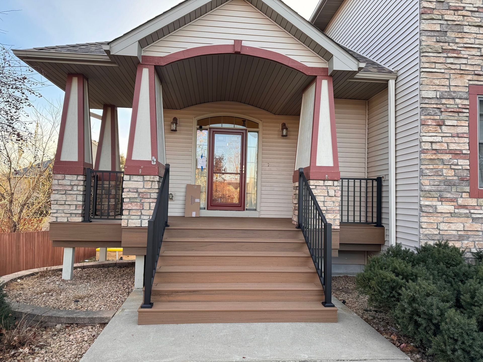 A house with stairs leading up to the front door