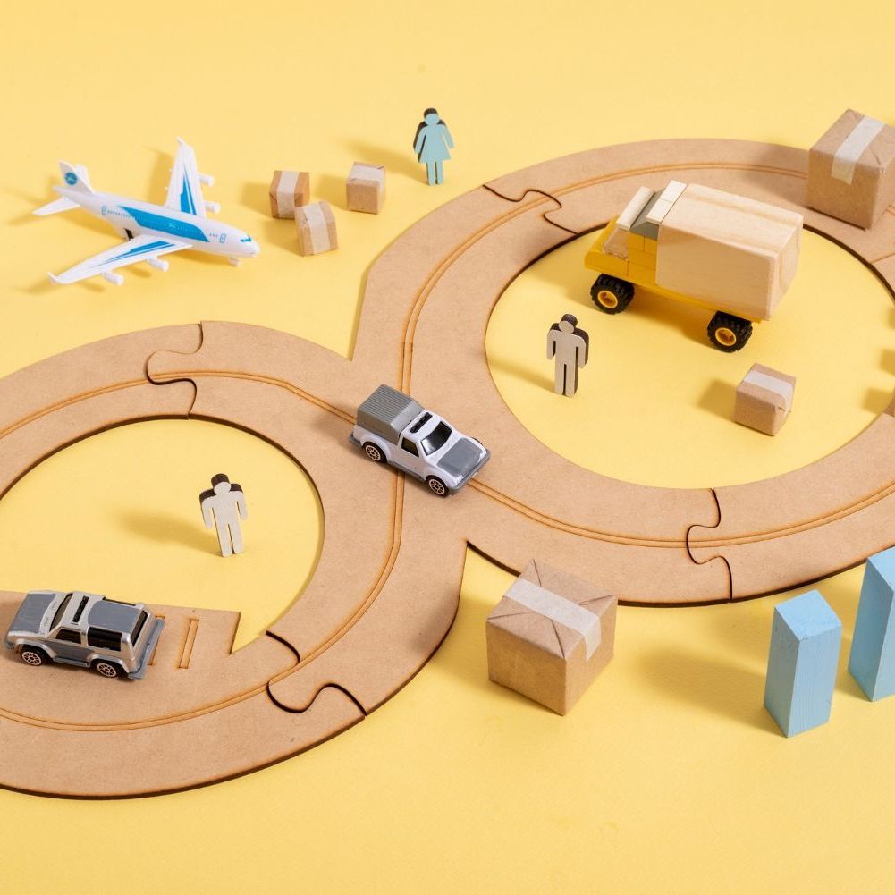 A toy airplane is sitting on top of a cardboard puzzle for Fraser Corporate Finance.