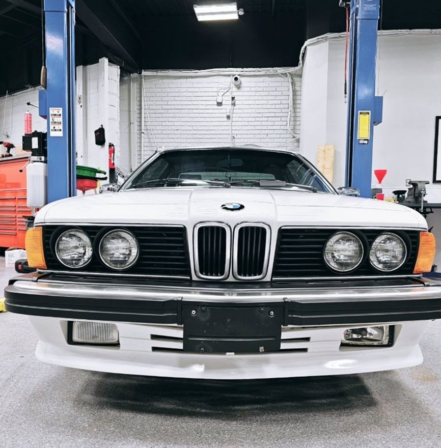 a white 1987 BMW parked in our Ancaster shop